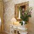 Cà Furlan Venice guest room with ornate mirror, desk, lamp, and gold drapes