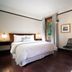 Naramata Inn guest room with king bed and private balcony in Naramata