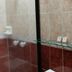 Hotel Bolivar Plaza in Manizales bathroom with tiled shower and wall mirror