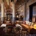 Hotel Emma in San Antonio lobby lounge with leather seating, industrial columns and warm lighting