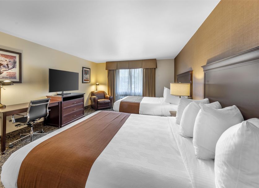 Best Western PLUS Truckee-Tahoe Hotel room with two beds, desk, TV and window seating in Truckee