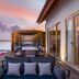 Hard Rock Hotel Maldives in Malé: overwater deck with seating, sunset lagoon views