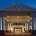 Quality Inn & Suites Bethany - Oklahoma City West entrance with lit portico at dusk