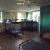 K - Town Hotel in Katherine room with bunk beds, tiled floor, ceiling fan and air conditioner