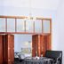 Bon Marie B&B in Hamilton dining area with table, chairs, and open wooden doors