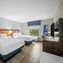 Hampton Inn & Suites Ft. Lauderdale West-Sawgrass/Tamarac guest room with two beds and window view in Tamarac