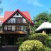 Shangrila Leisure Farm in Dongshan Township, a chalet-style hotel with a red roof and lush gardens
