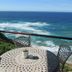 Brenton On The Rocks in Brenton-on-Sea balcony with table overlooking ocean waves