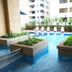 Seri Bukit Ceylon Suites Bukit Bintang Kuala Lumpur pool with lounge chairs and tropical landscaping