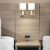 Red Roof Inn Greenville room with two twin beds, bedside table, and wall lights