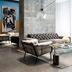 The Elser Hotel Miami lounge in Miami with modern seating, glass coffee table and tall concrete feature wall