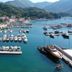 Boutique Hotel Kredo in Herceg Novi overlooking a marina with yachts, docks and mountain views