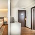 Vip Executive Picoas Hotel, Lisbon guest room with twin beds, bedside lamps, and wood flooring