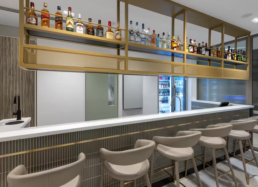 Haberfield Hotel Sydney bar counter with high stools and backlit liquor shelves