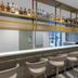 Haberfield Hotel Sydney bar counter with high stools and backlit liquor shelves