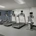 Homewood Suites by Hilton Alexandria/Pentagon South fitness room with treadmills, ellipticals and weight bench