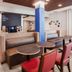 Holiday Inn Express & Suites Chicago O'hare Airport By IHG lobby seating and coffee station in Des Plaines