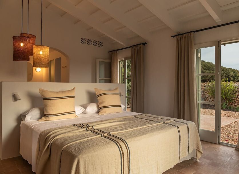 Hotel Rural Sant Ignasi in Ciutadella de Menorca: bright room with double bed and terrace doors