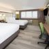 Holiday Inn Express & Suites Wilmington West - Medical Park By IHG guest room with two queen beds and desk