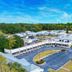 Motel 6 Moultrie, GA exterior with parking lot and blue sky in Moultrie