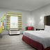 Hampton Inn & Suites El Paso-East room with king bed, desk, window seat, and city view in El Paso