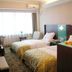 Nan Xiang Hotel - Guiyang twin room with two beds, window seating, and air conditioner