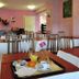 Prim Hôtel Reims dining room with tables set for breakfast in Reims
