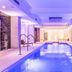 Abaton Island Resort & Spa in Hersonissos indoor pool with spa lighting and loungers