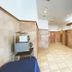 Toyoko Inn Izumo-shi Ekimae lobby with tiled floor, tan walls, and reception desk in Izumo