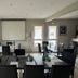 Hôtel Parc Adélie meeting room in Montagny-lès-Beaune with set tables and projector screen