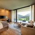Almwellness Hotel Pierer in Fladnitz guest room with balcony mountain views and seating area
