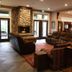 Hearthstone Elegant Lodge by the River in Kamiah lobby with stone fireplace and seating area