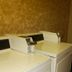 Laundry room at Super 8 by Wyndham Potosi with washers, dryers, and soap, bleach, softener dispenser