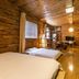 Home++ Xi'an in Xi'an: rustic wooden guest room with two beds, desk, and warm ambient lighting