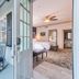 The Beaufort Inn in Beaufort: private porch with rocking chairs and an open bedroom doorway