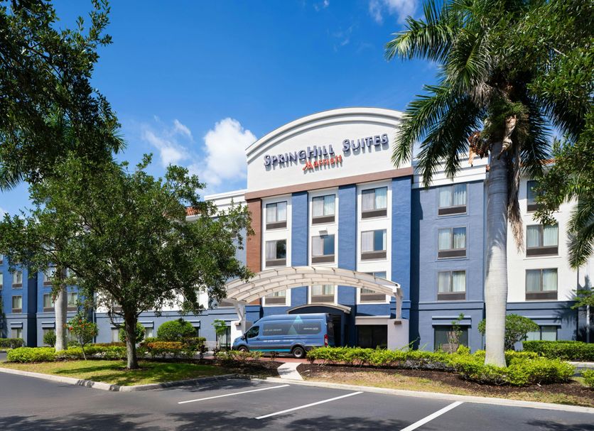 SpringHill Suites by Marriott Fort Myers Airport exterior in Fort Myers with palm trees and entrance