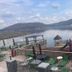 Wyndham Garden Lake Guntersville outdoor lakefront patio with seating and playground by the water