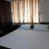 Sr Residency in Tiruchirappalli guest room with double bed, wardrobe and sunlit curtains