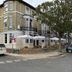 The Embassy Hotel in Great Yarmouth, corner exterior with outdoor seating and street parking