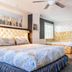 Big Bear Spa Suites in Big Bear Lake: stylish suite with king bed, window bench, and ceiling fan
