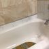 Diamond View Motel in Susanville: clean white bathtub with chrome faucet and beige tile surround