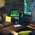 Hotel Les Bougainvilliers in Saint-Paul with a tropical lounge, dark wicker seating and aquarium