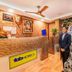 Fabhotel Rajnandani Residency, Indore reception area with front desk, seating and waterfall wall mural