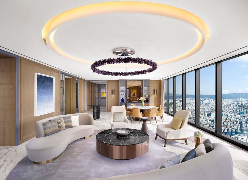 Sofitel Ambassador Seoul Hotel & Serviced Residences lounge with city skyline views and curved seating