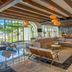 Fiesta Americana Cancun Villas lobby with lounge seating and large arched windows in Cancún