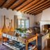 Herdade da Malhadinha Nova - Relais & Châteaux lounge in Beja with fireplace, wooden ceiling and seating area