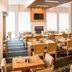 Holiday Inn Salem (I-93 At Exit 2) By IHG dining room with tables, chairs and fireplace