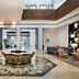 Le Méridien Abu Dhabi Resort lobby with mosaic floor centerpiece, seating area and double-height atrium in Abu Dhabi