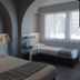 Hôtel Valencia in Hendaye guest room with two beds and arched ceilings