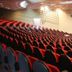 Garden Hotel in Campina Grande auditorium with rows of red and black seats facing a stage
